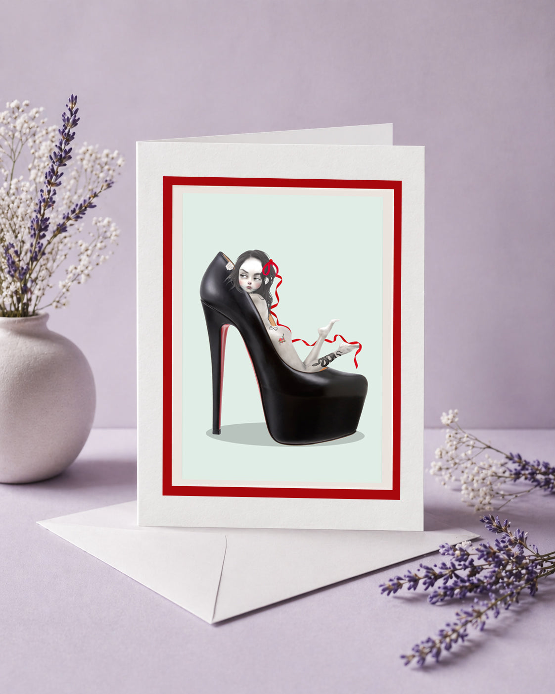 pop surrealism greeting card features a tattooed girl in an oversized black stiletto high heel.