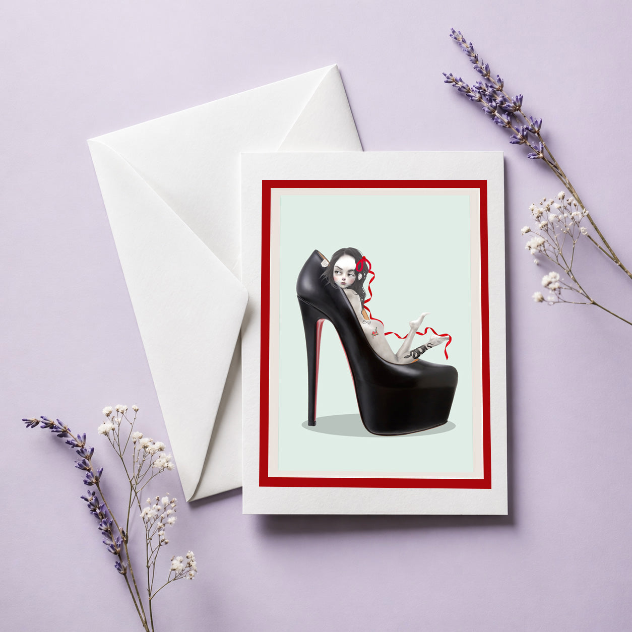 pop surrealism greeting card & envelope by HarrietsImagination. Features a tattooed girl in an oversized black stiletto high heel