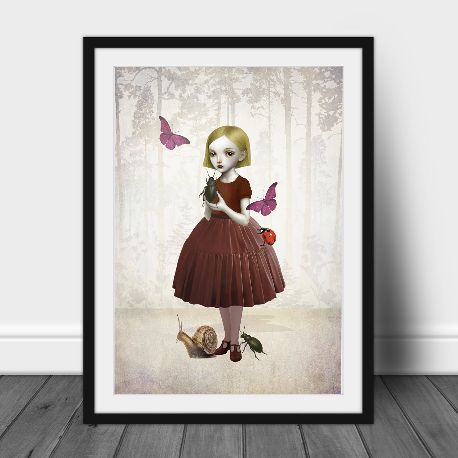 Framed artwork of a girl in a forest with butterflies and a snail.