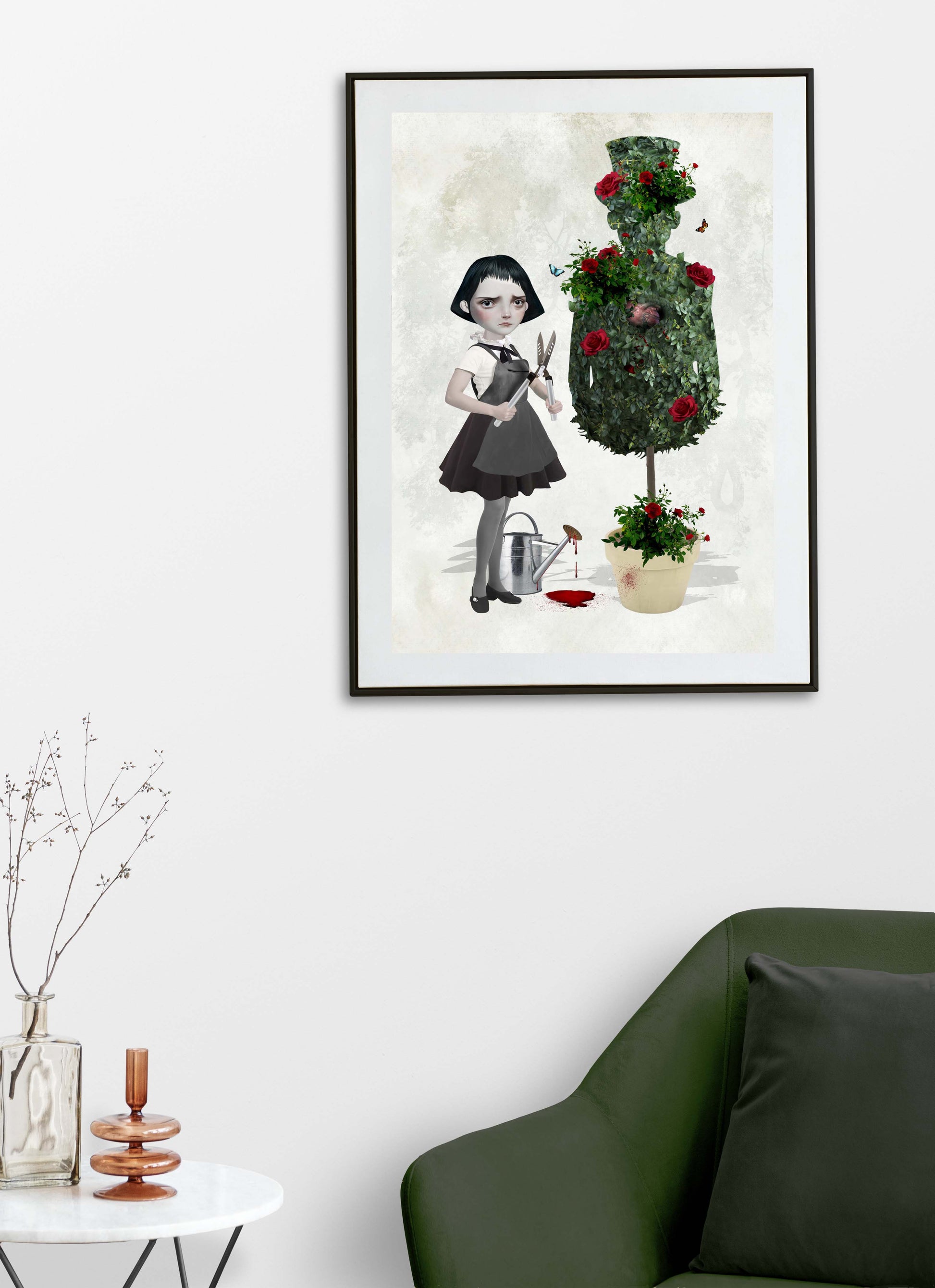 A goth girl art print topiary, framed and hanging on a living room wall. Perfect for adding a creepy cute touch to gothic or alternative home decor.