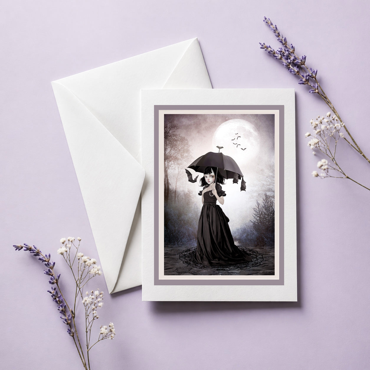 Blank art greeting card featuring a whimsical dark fantasy illustration of a girl with bats under a full moon.