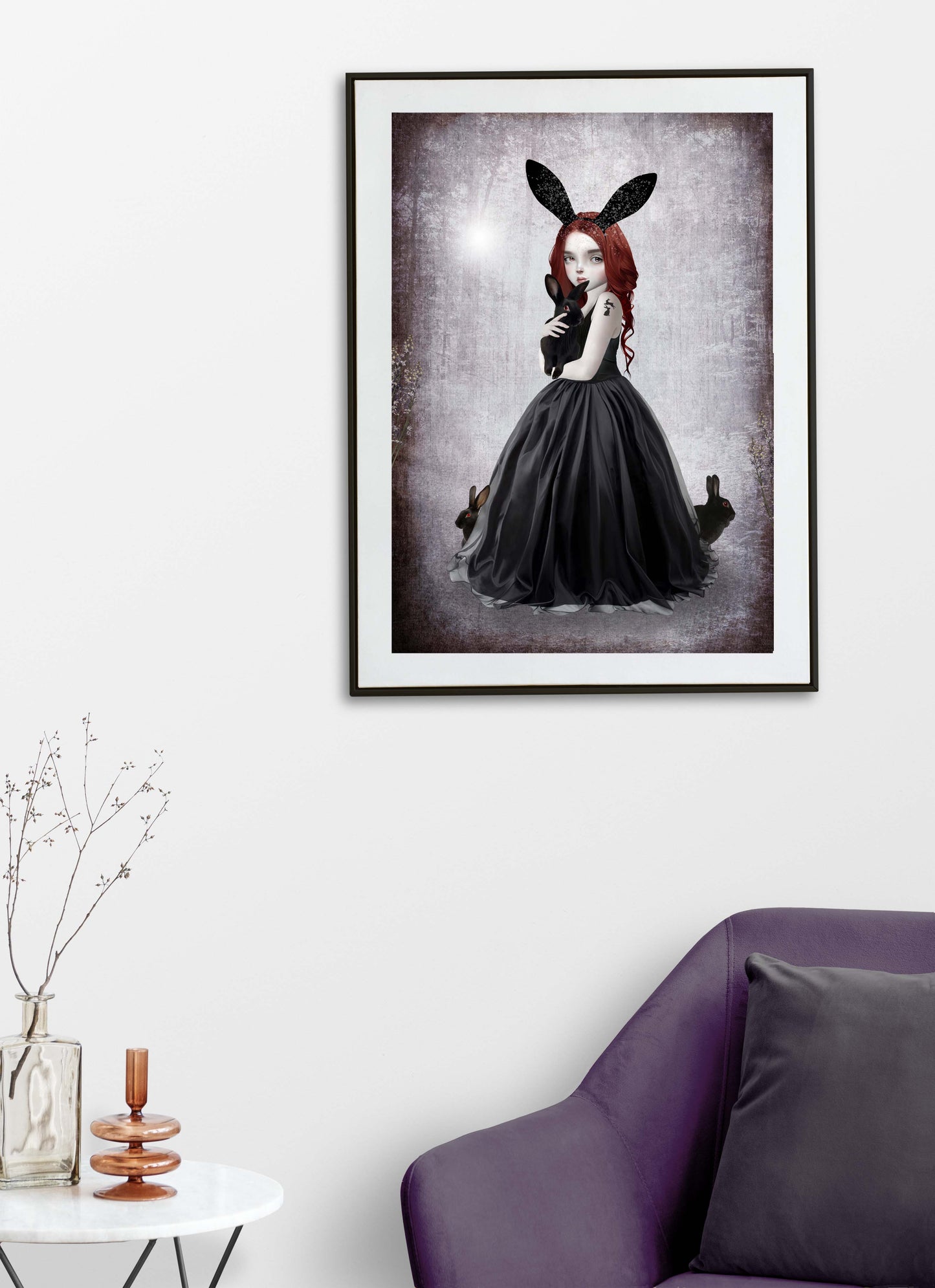 Goth Girl and rabbits art print hanging on the wall of a modern living room. Perfect for adding a creepy cute touch to gothic or alternative home decor.