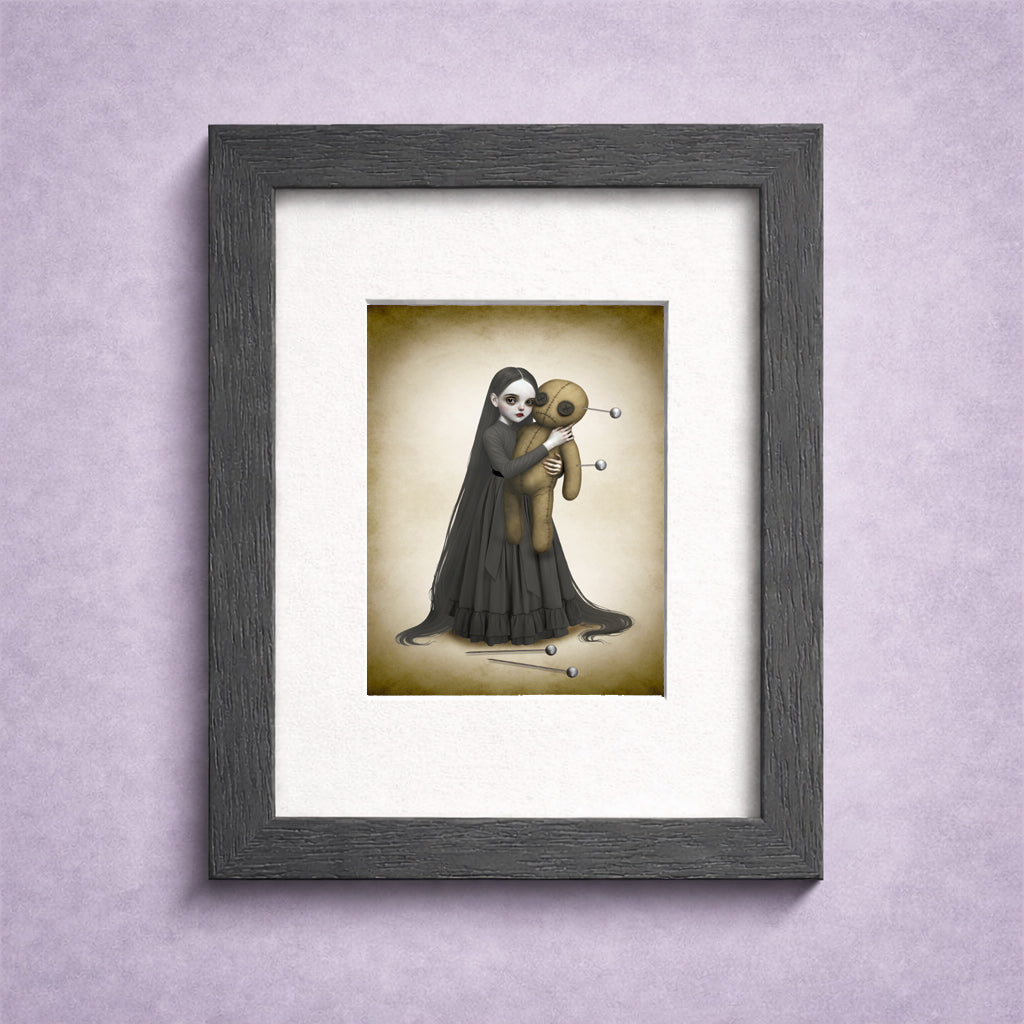 Goth girl And Voodoo Doll ACEO Card in a small frame for display.
