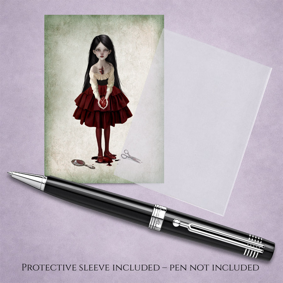 ACEO art card with protective sleeve featuring a gothic girl holding a bleeding anatomical heart with a broken mirror at her feet.
