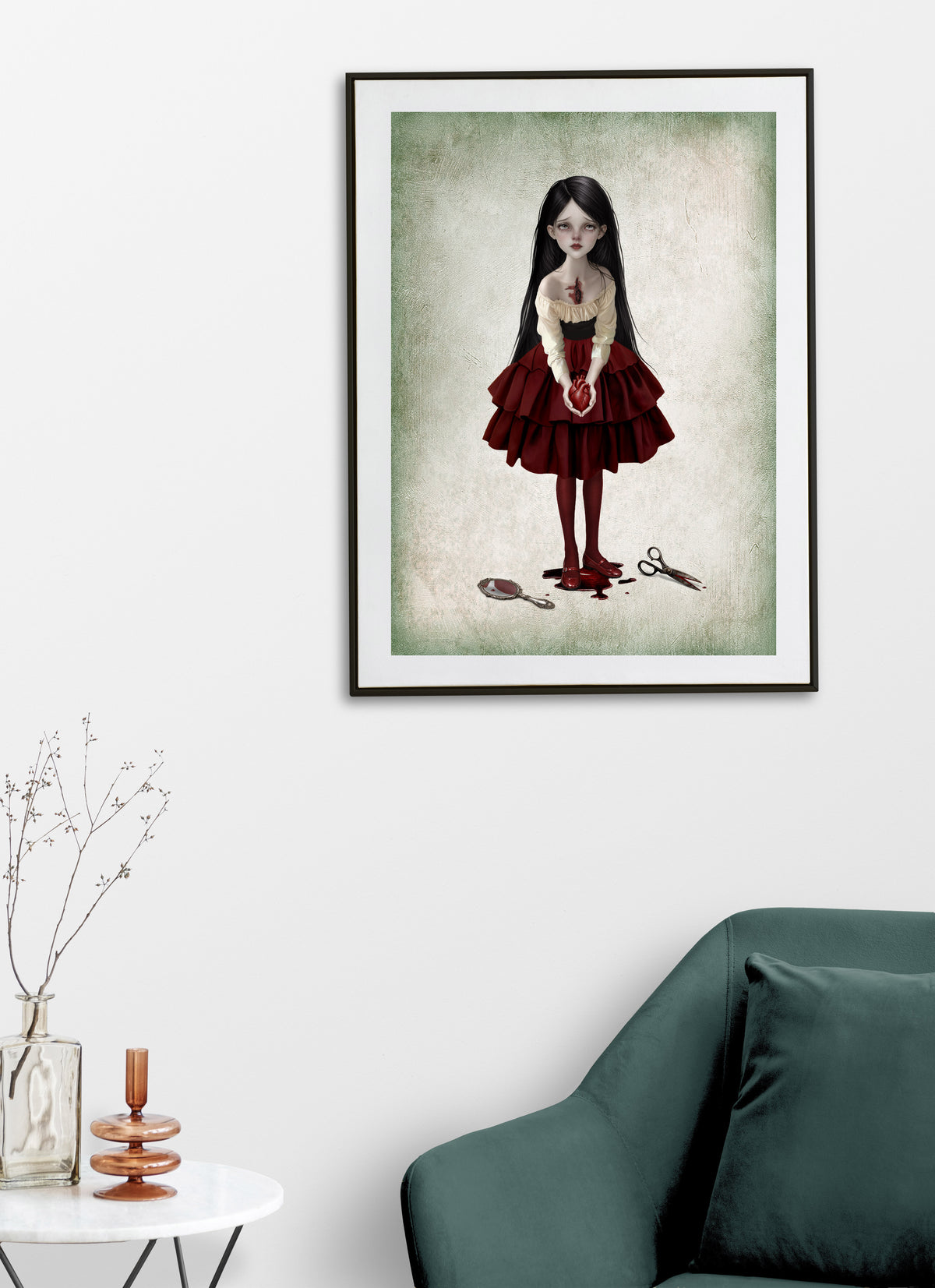 Gothic dark romance fine art print displayed on a living room wall featuring a girl holding a bleeding anatomical heart near a broken mirror and scissors on a soft green background.