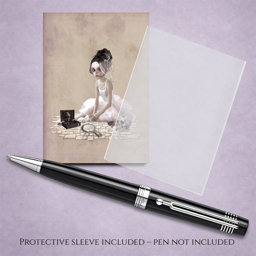 ACEO art card with illustration of a gothic ballerina and skull, next to a cello sleeve and pen for display.