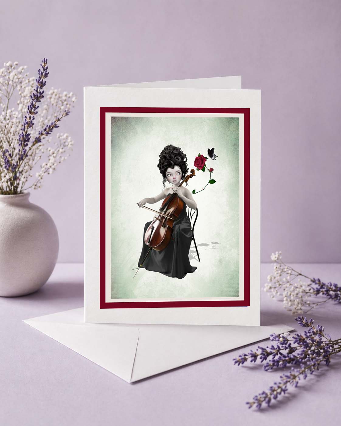 Greeting card with a woman playing a cello and holding a rose, surrounded by flowers on a light purple background.