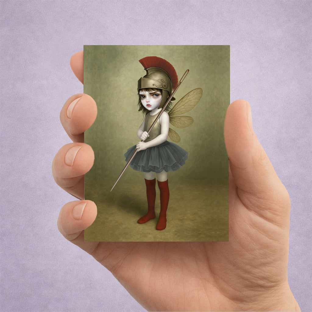 surreal fantasy ACEO miniature art card print. Featuring a fierce, big-eyed dark fairy dressed as an ancient warrior—complete with a plumed Roman helmet and a sewing needle spear.