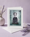 Greeting card with a ghost girl resting on her tombstone on a purple background