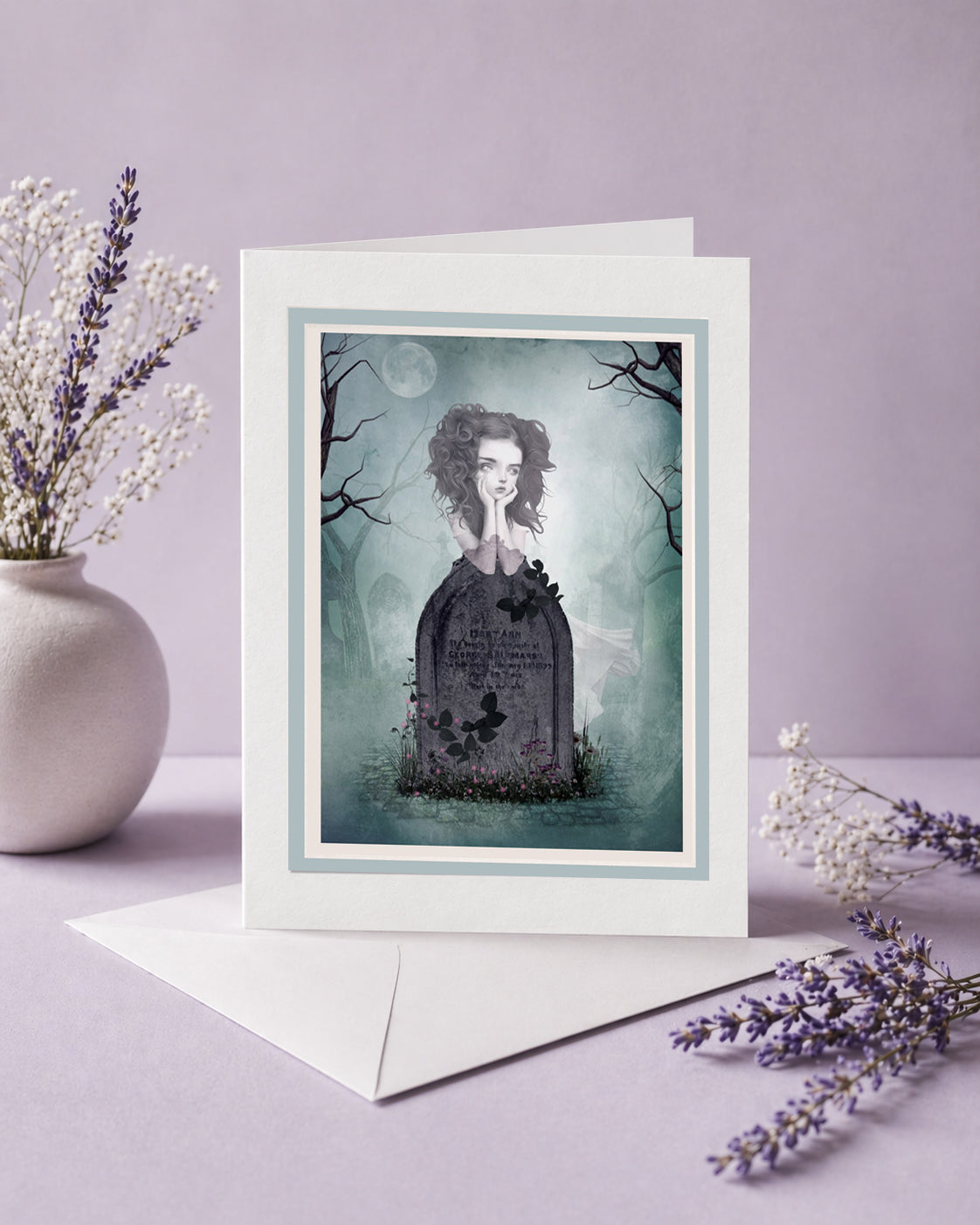 Greeting card with a ghost girl resting on her tombstone on a purple background