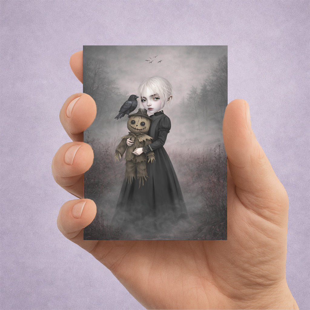 Gothic ACEO Card features a pale, platinum-haired girl holding a stitched, creepy-cute scarecrow doll. Accompanied by a watchful black crow amidst a misty, atmospheric landscape,