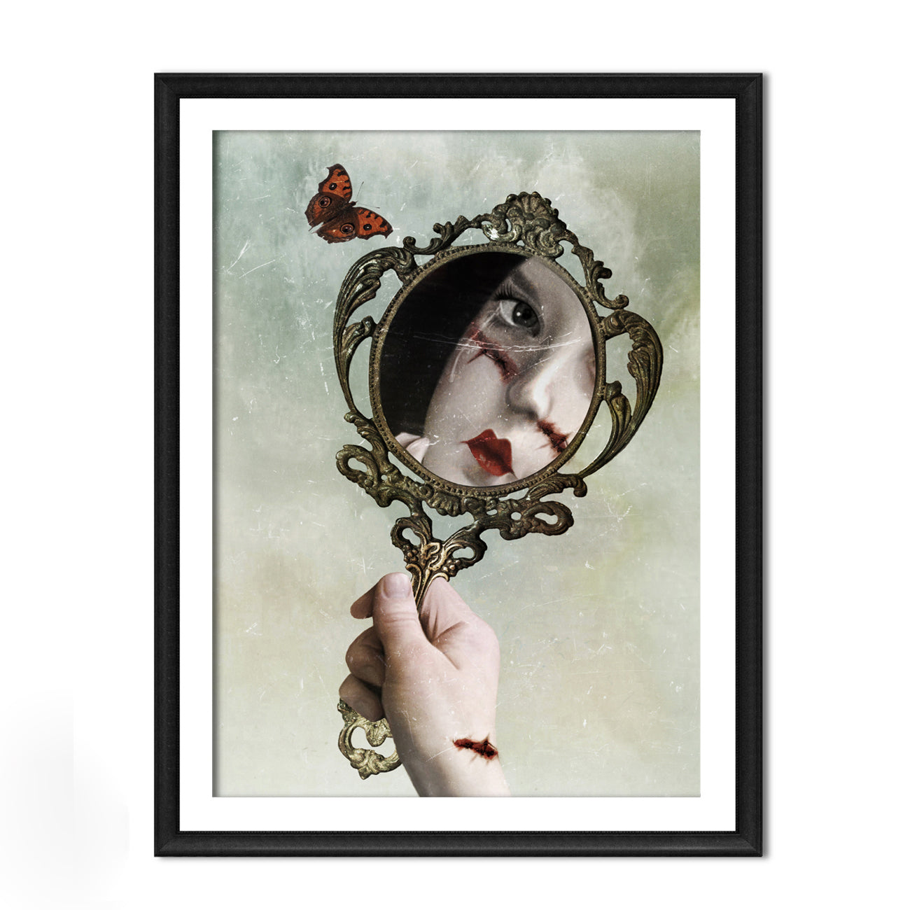 Dark surrealism gothic mirror art print in an A4 frame featuring a stitched portrait, vintage hand mirror and butterfly.