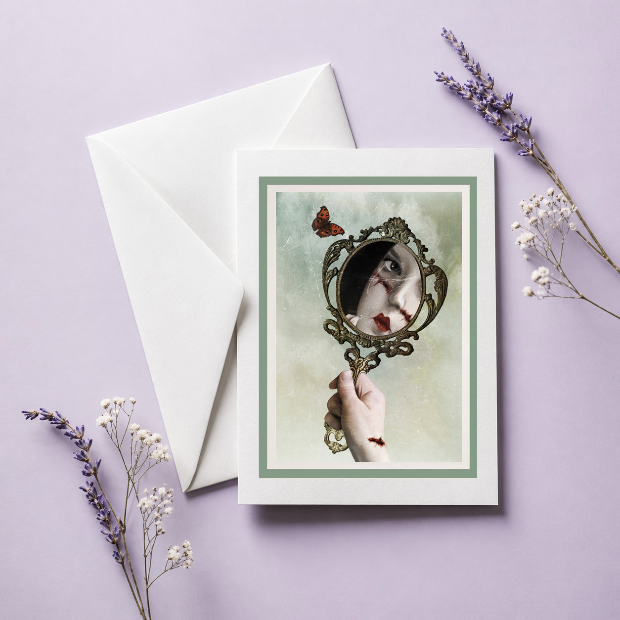 Gothic mirror art greeting card with white envelope, displayed open and ready to frame. The surreal artwork features a vintage mirror reflection, a butterfly, and dark fantasy imagery.