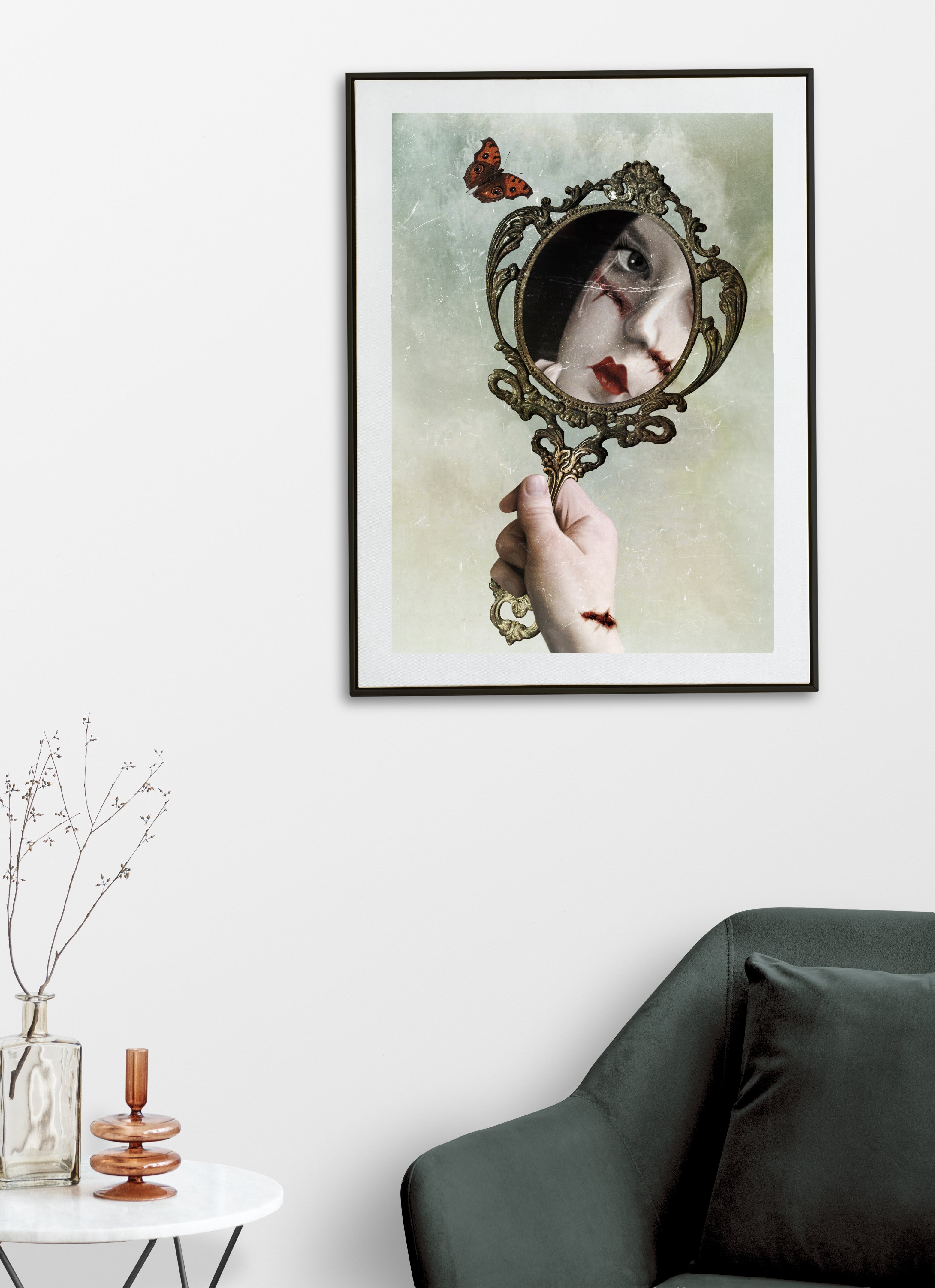 Dark surrealism gothic mirror art print of a stitched portrait, vintage hand mirror and butterfly displayed on a living room wall.