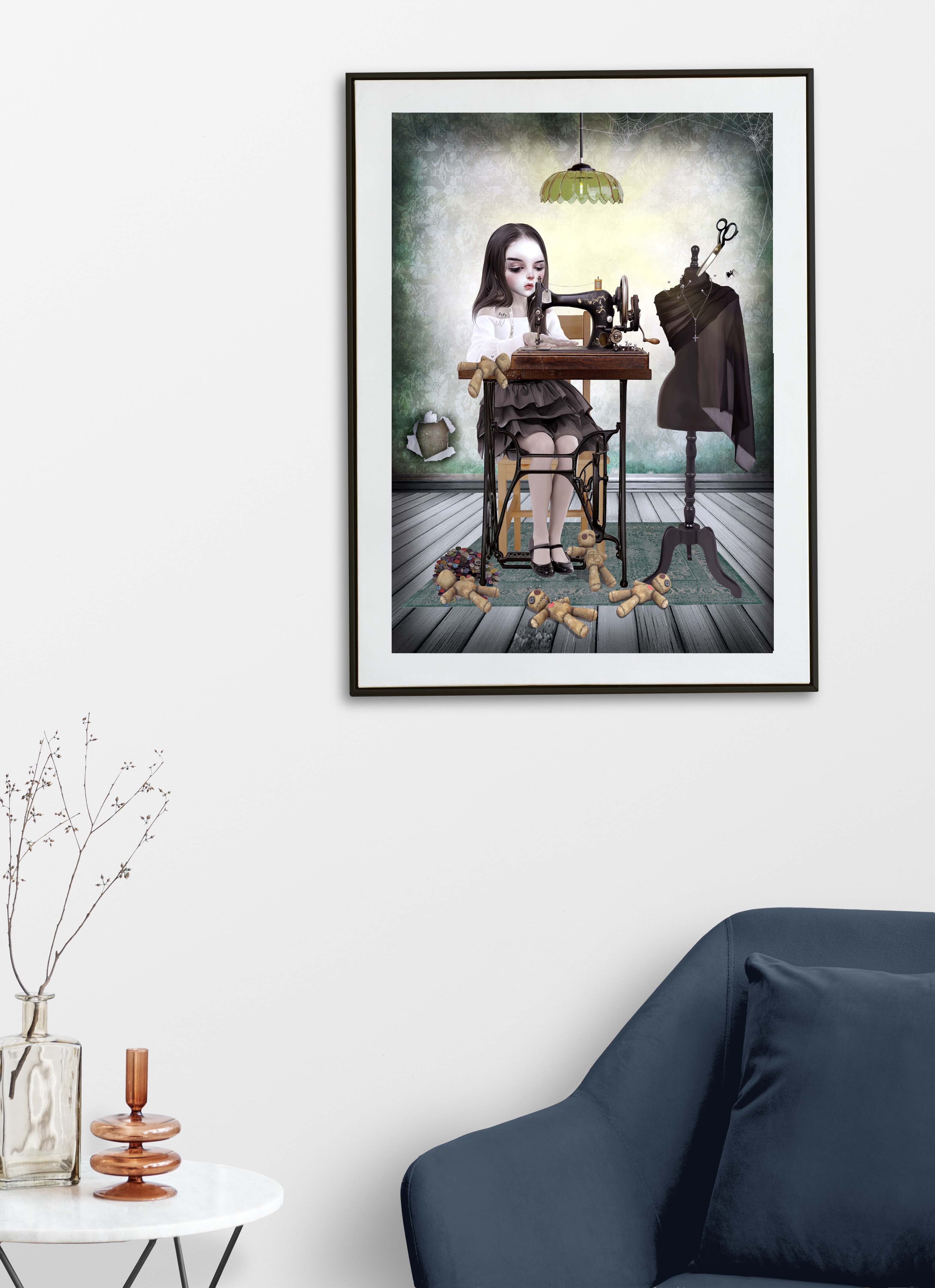 Framed artwork of a woman at a sewing machine with voodoo dolls in a room with a blue sofa and decorative items.