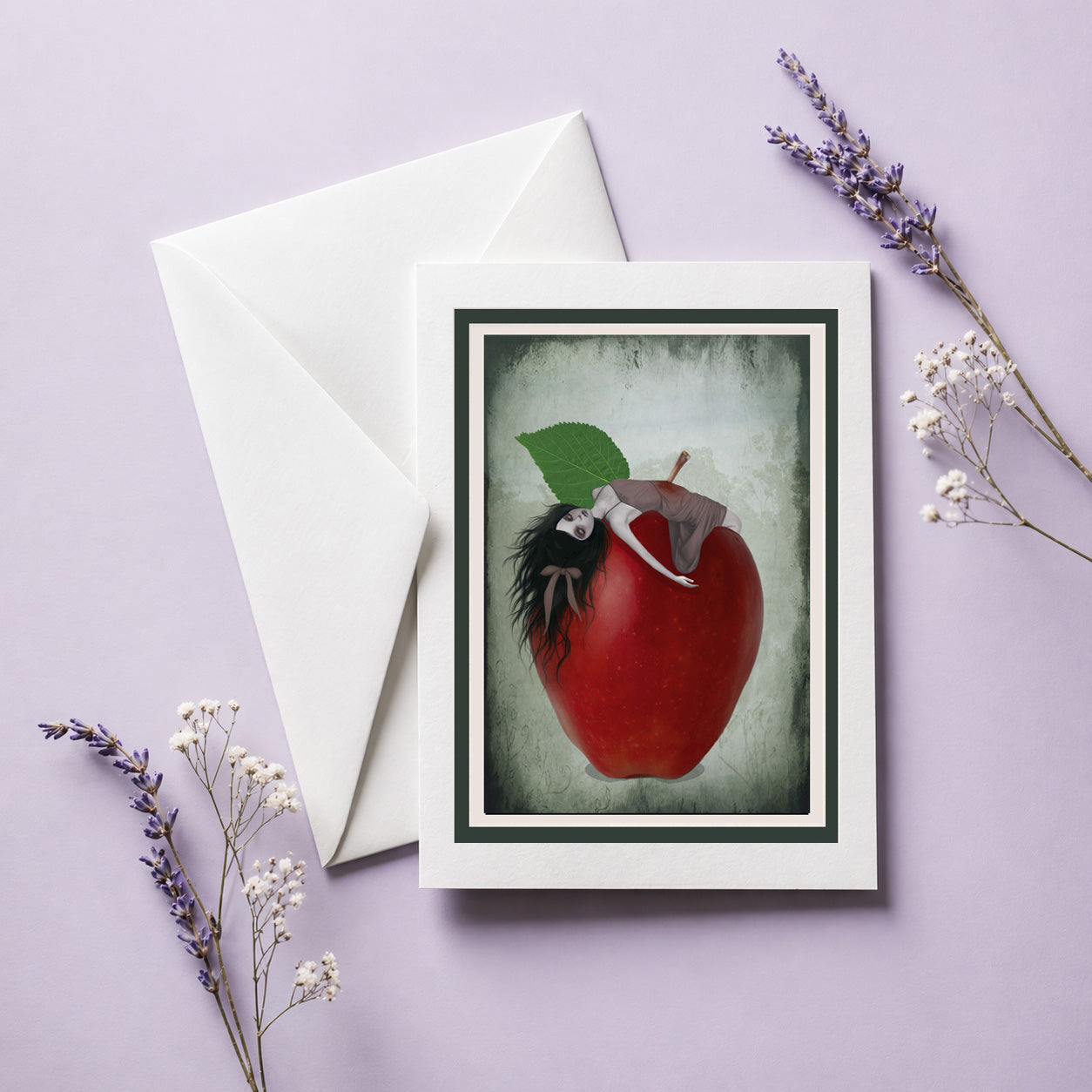 Greeting card with Snow White impaled on the stalk of a red apple illustration on a purple background