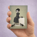 A miniature gothic ACEO art card featuring a surreal illustration of a girl on a giant sugar cube with large ants, held upright in a person's hand against a textured purple background.
