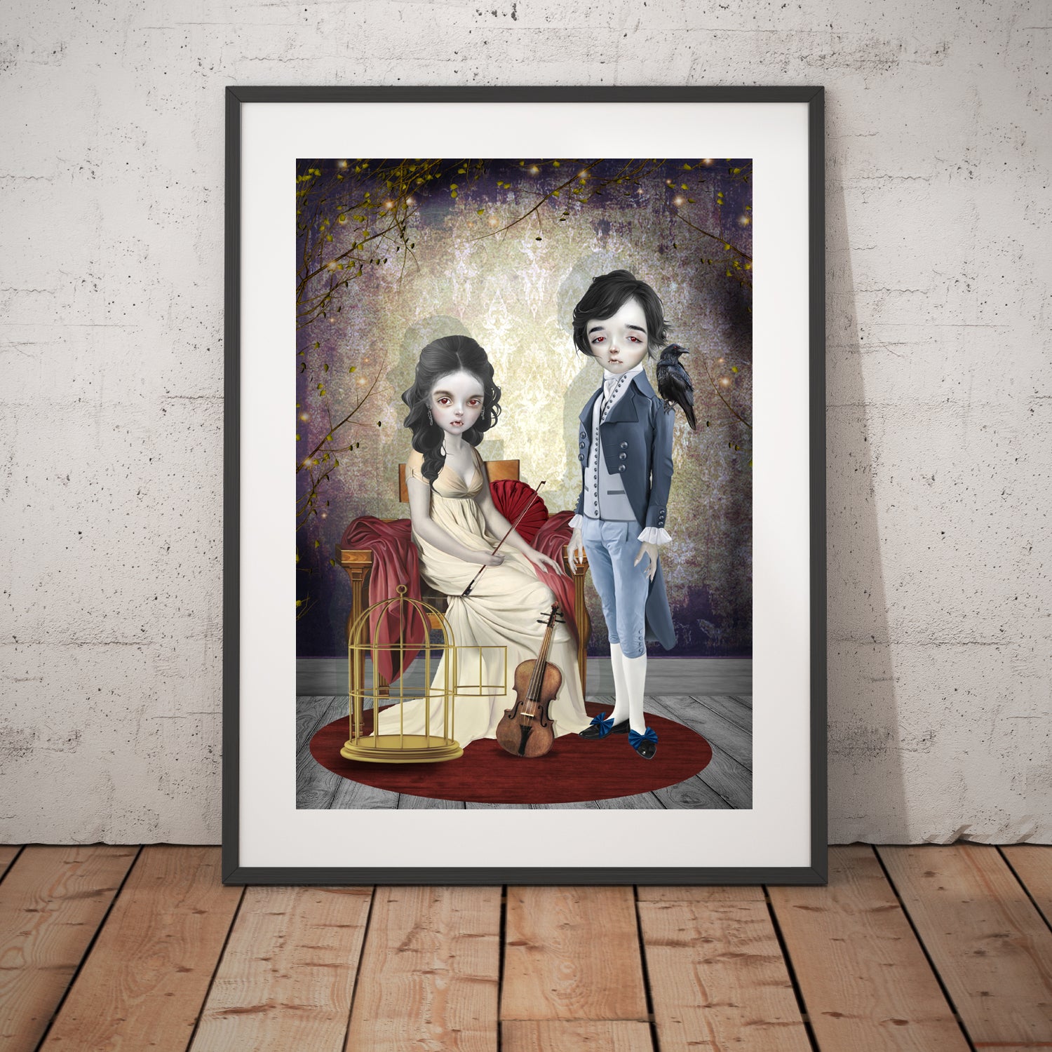 Gothic vampire art print in a black frame, standing against a white wall.