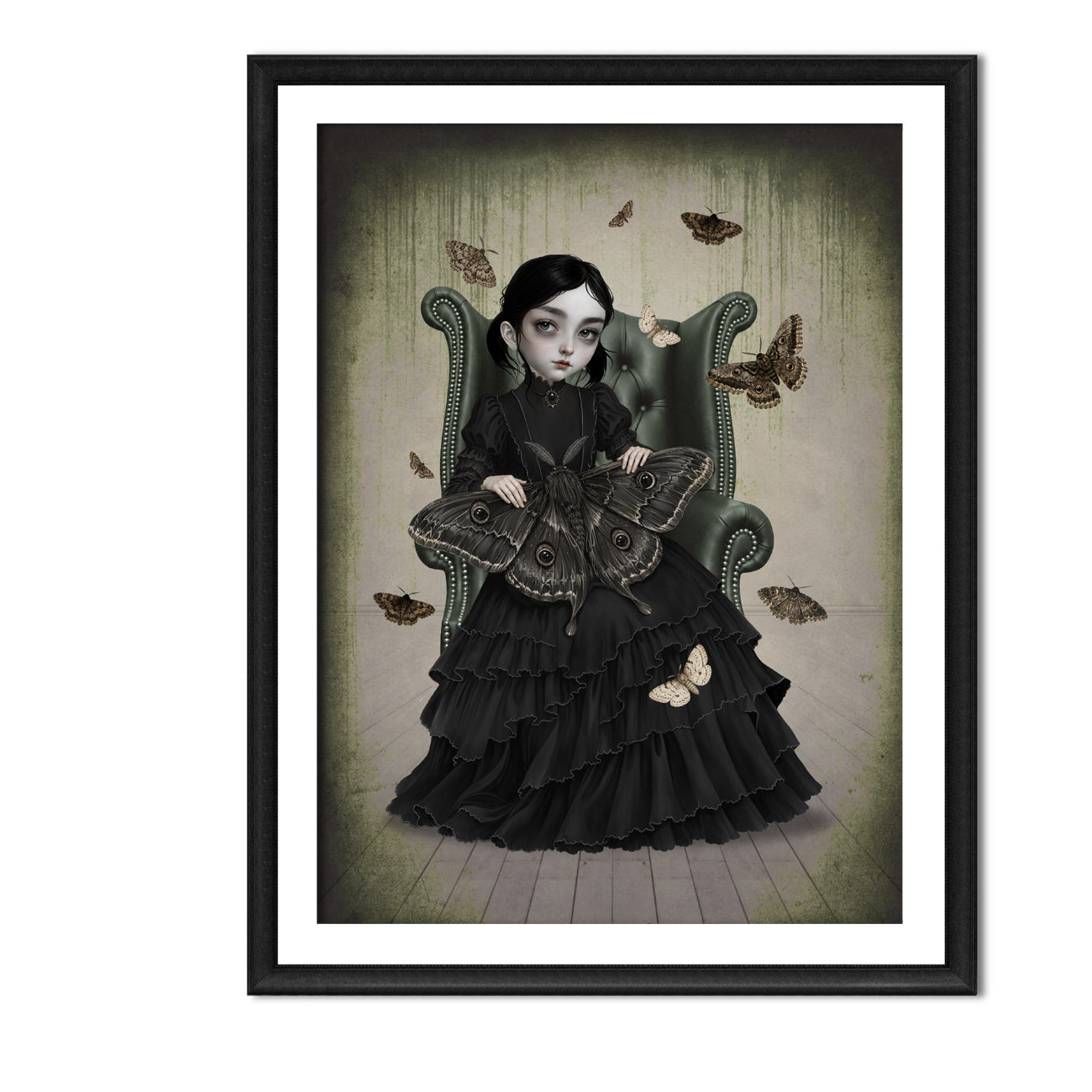 A framed gothic art print featuring a young girl in a black ruffled dress sitting in a green armchair, surrounded by moths, with a black frame and white mat on a white background.
