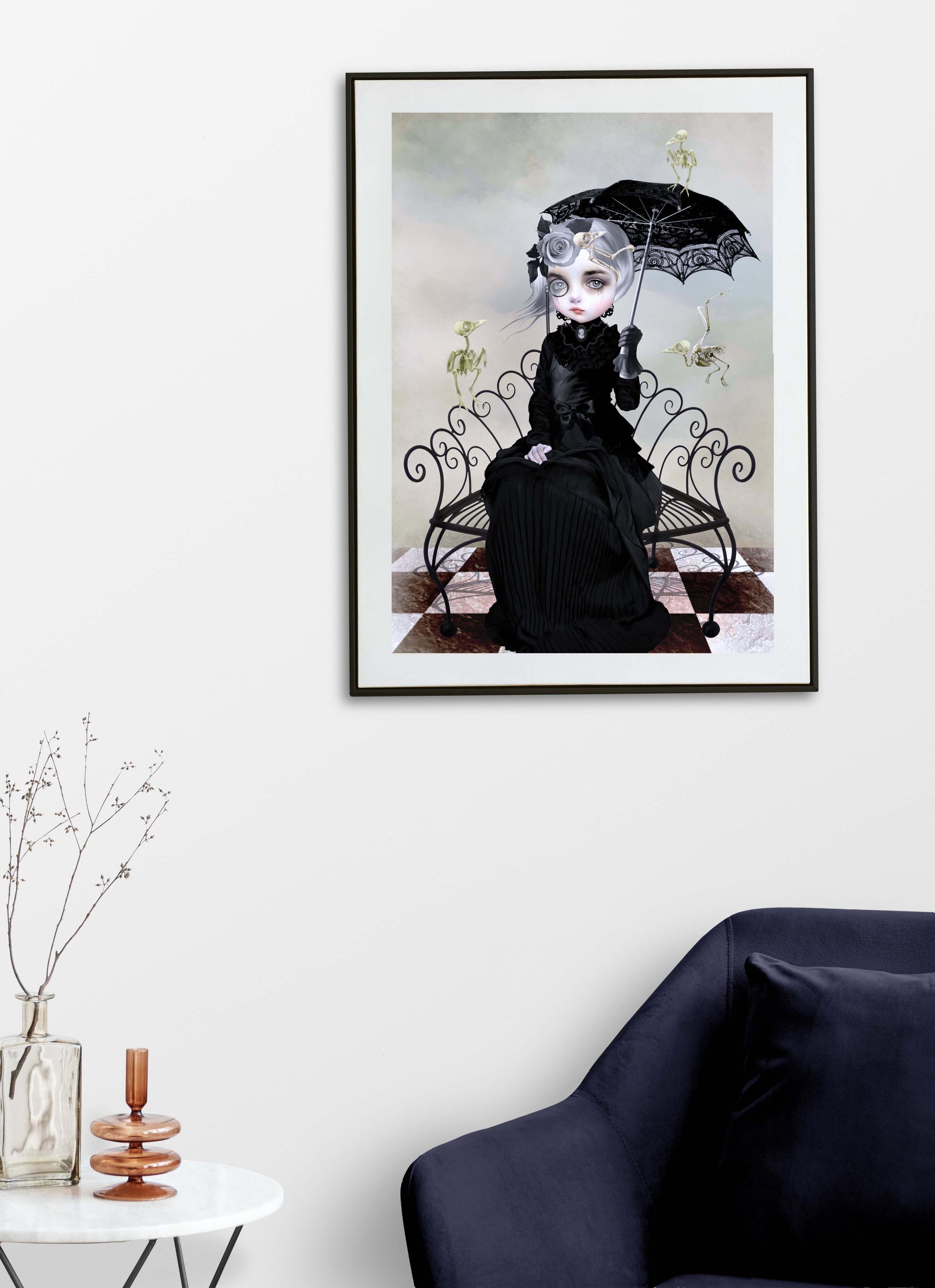 Victorian lady and skeleton birds print on living room wall. Depicting a somber woman adorned in black, surrounded by the eerie remains of her beloved birds. 