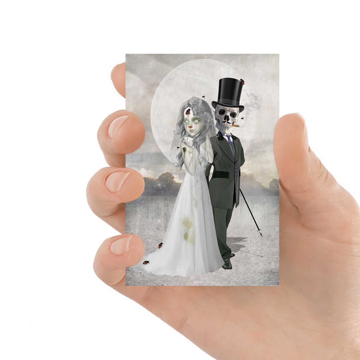 ACEO art card featuring a skeleton groom and zombie bride, held in hand—creepy cute gothic art style with dark, whimsical elements.
