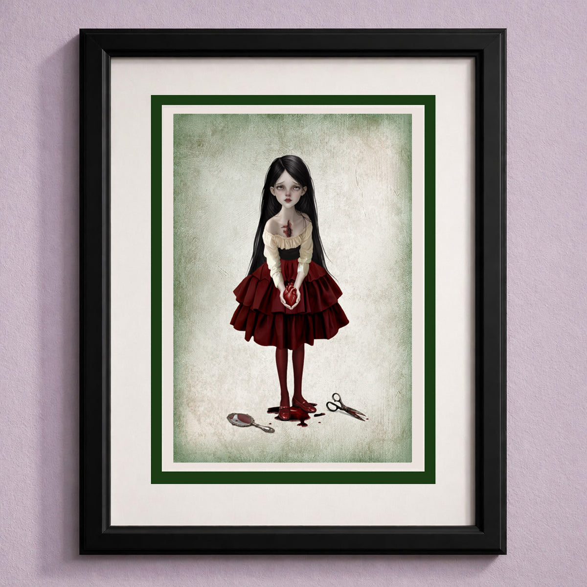 Framed art greeting card featuring a gothic-style illustration of a girl with long black hair, wearing a red dress and holding a red heart, standing on a textured light background. The card has a dark green inner border, a white mat, and is housed in a black frame, displayed against a lavender wall.