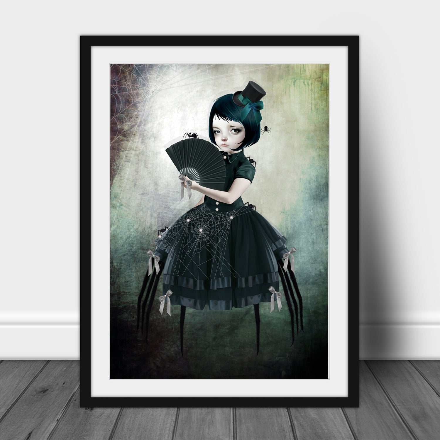 Creepy cute wall art print, a spider girl, clad in sleek black. With her elegant merging of woman and arachnid, she is surrounded by an array of tiny spider