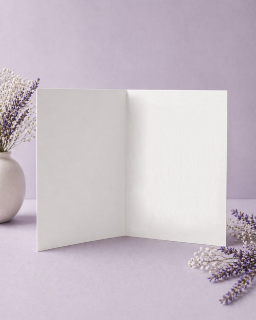 Open white card on a light purple background with lavender flowers.
