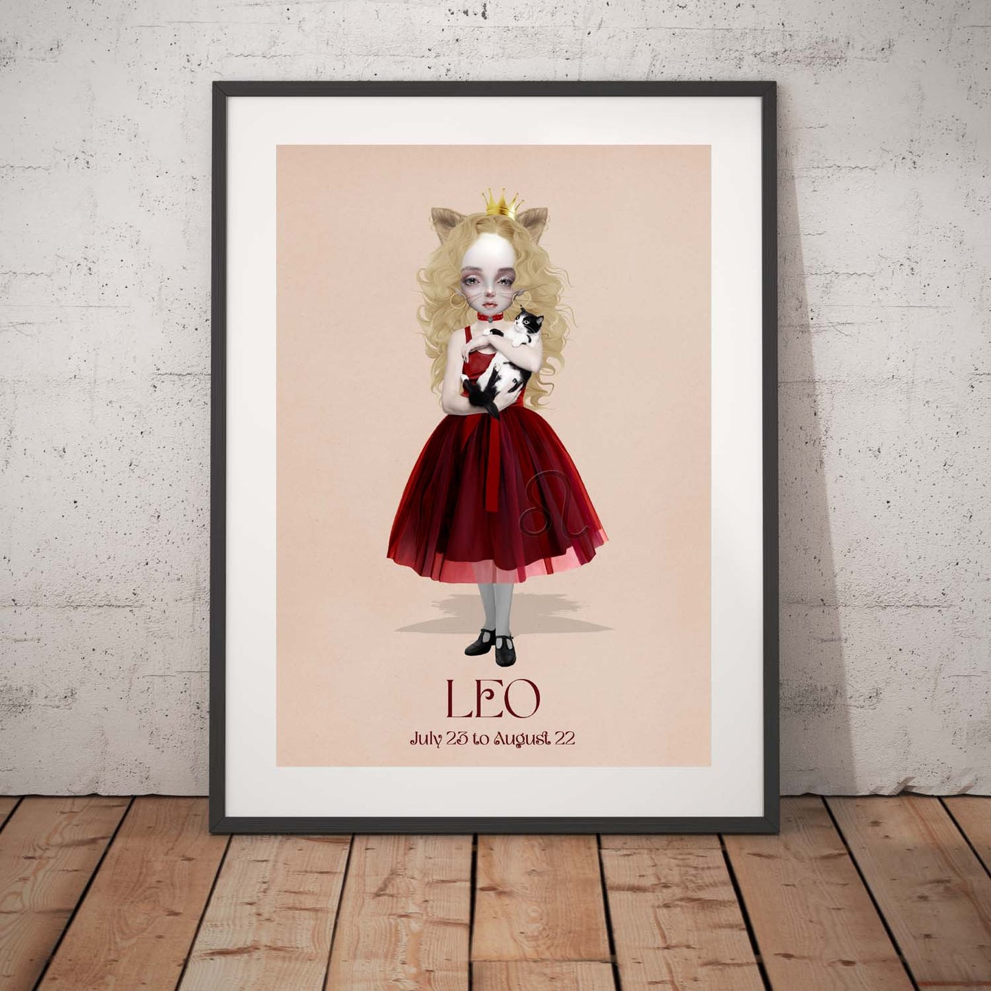 Leo girl star sign art print in a black frame, standing against a white wall.