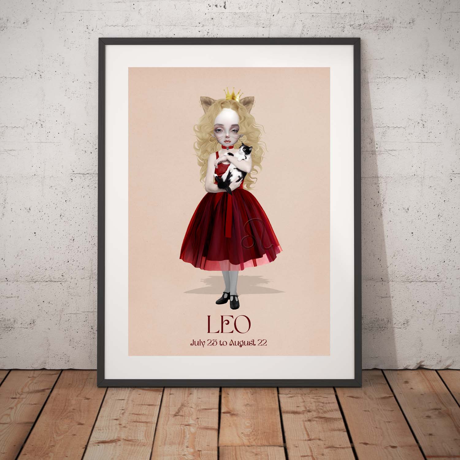 Leo girl star sign art print in a black frame, standing against a white wall.