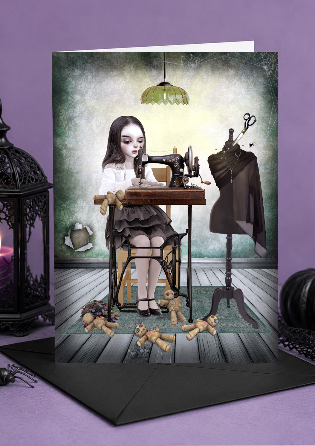 Halloween card featuring a gothic girl sewing handmade voodoo dolls with a vintage sewing machine in a spooky room.