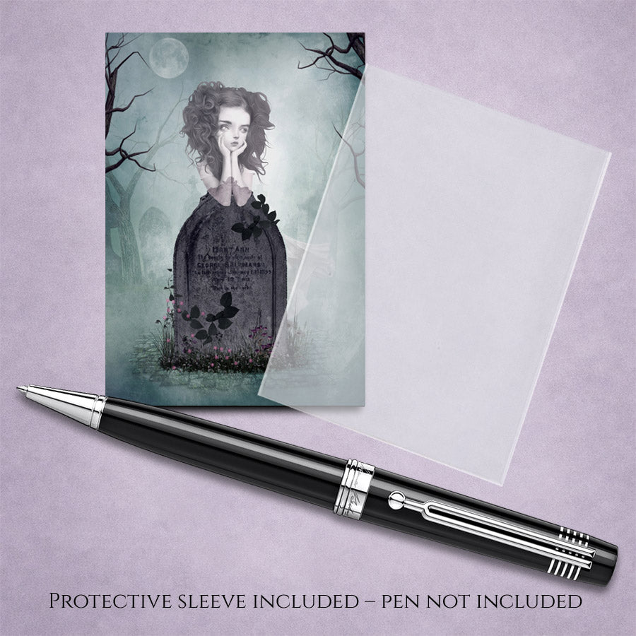 Gothic-themed ACEO card of ghost girl in graveyard, with a pen on a light purple background