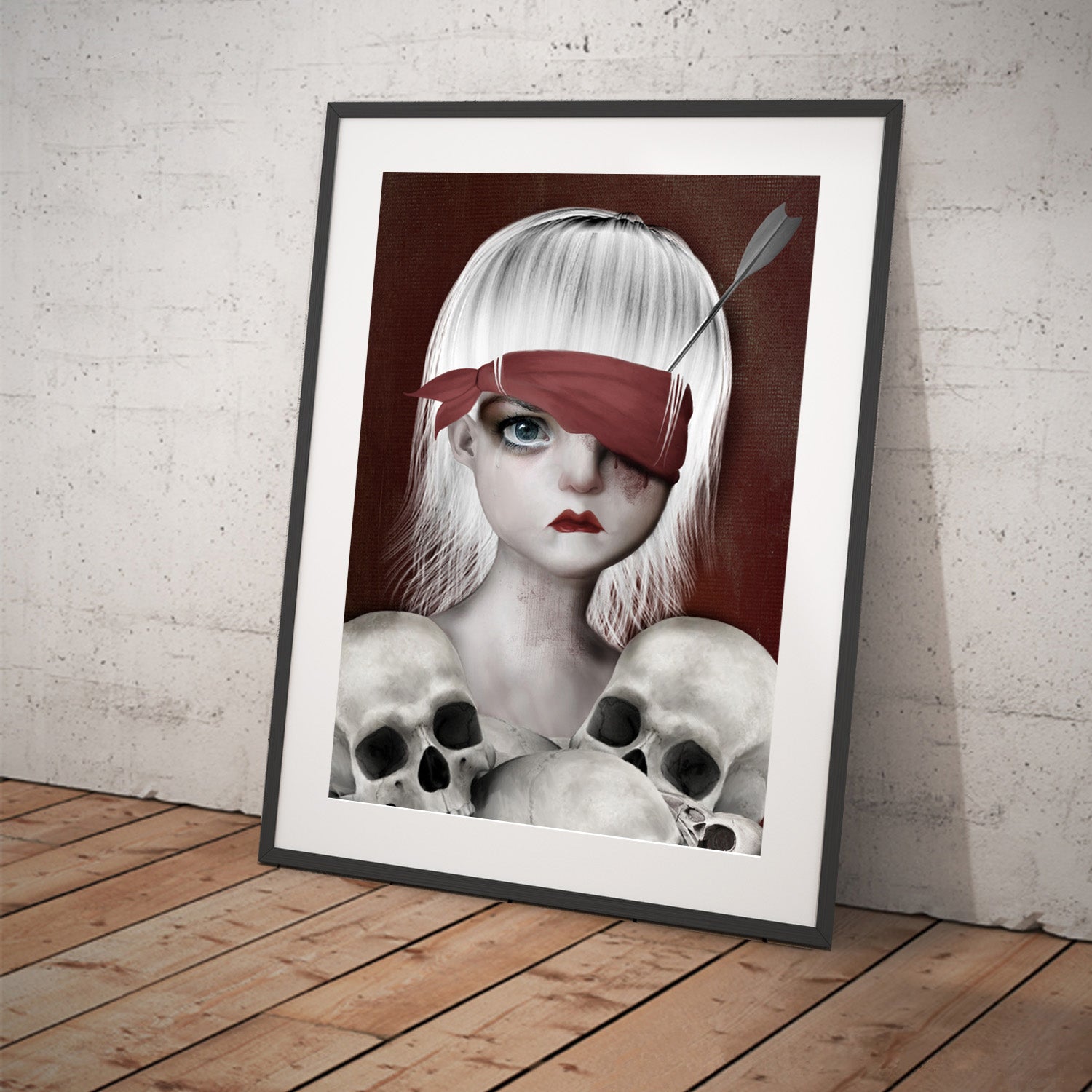 Memento mori Art Print. Featuring a girl with an arrow in her eye surrounded by human skulls