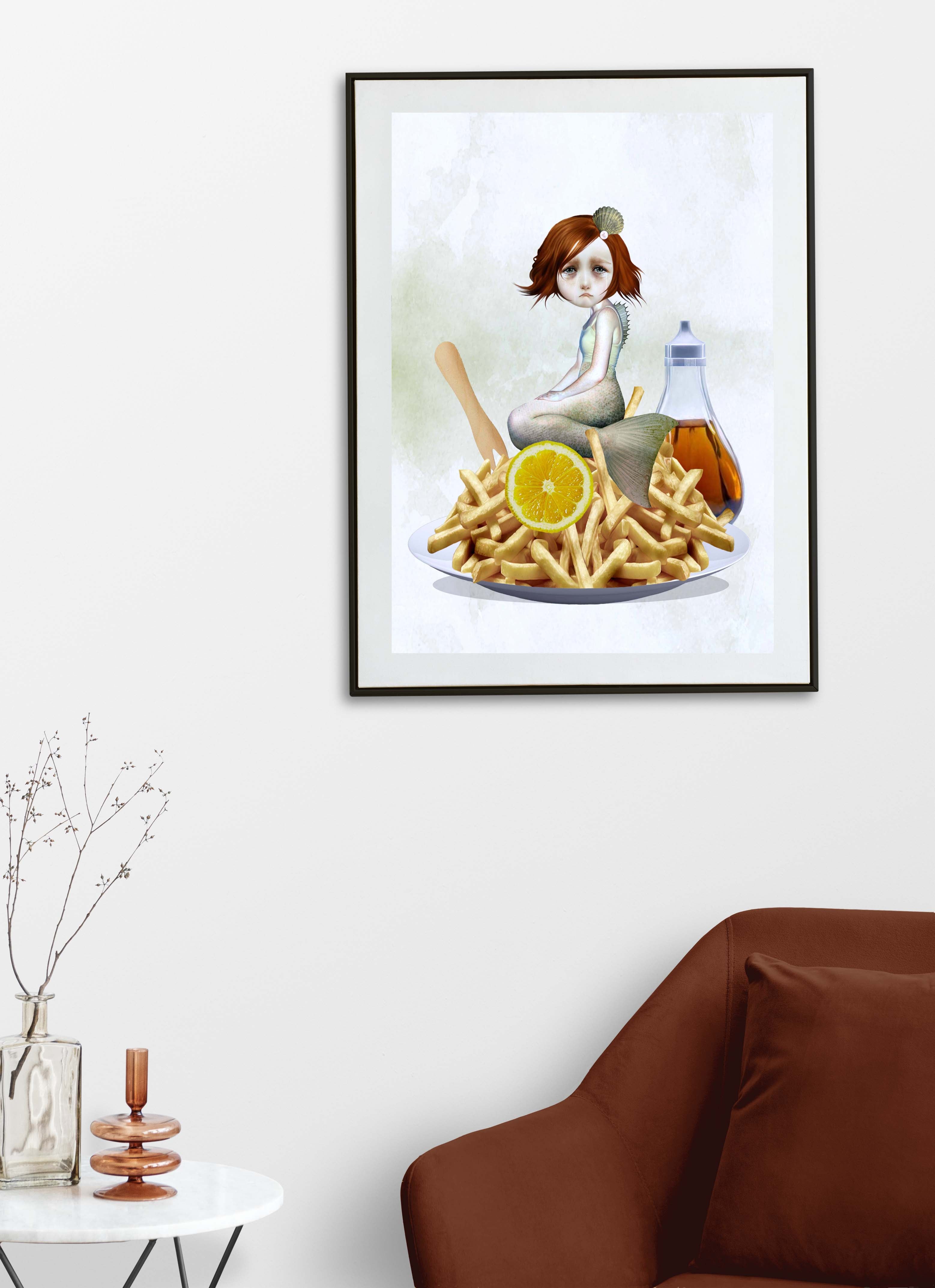 Framed artwork of a mermaid with chips and condiments on a white wall above a brown sofa.