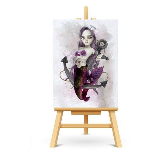 Miniature ACEO art of a mermaid and anchor, blending nautical with fantasy, displayed on a small stand.