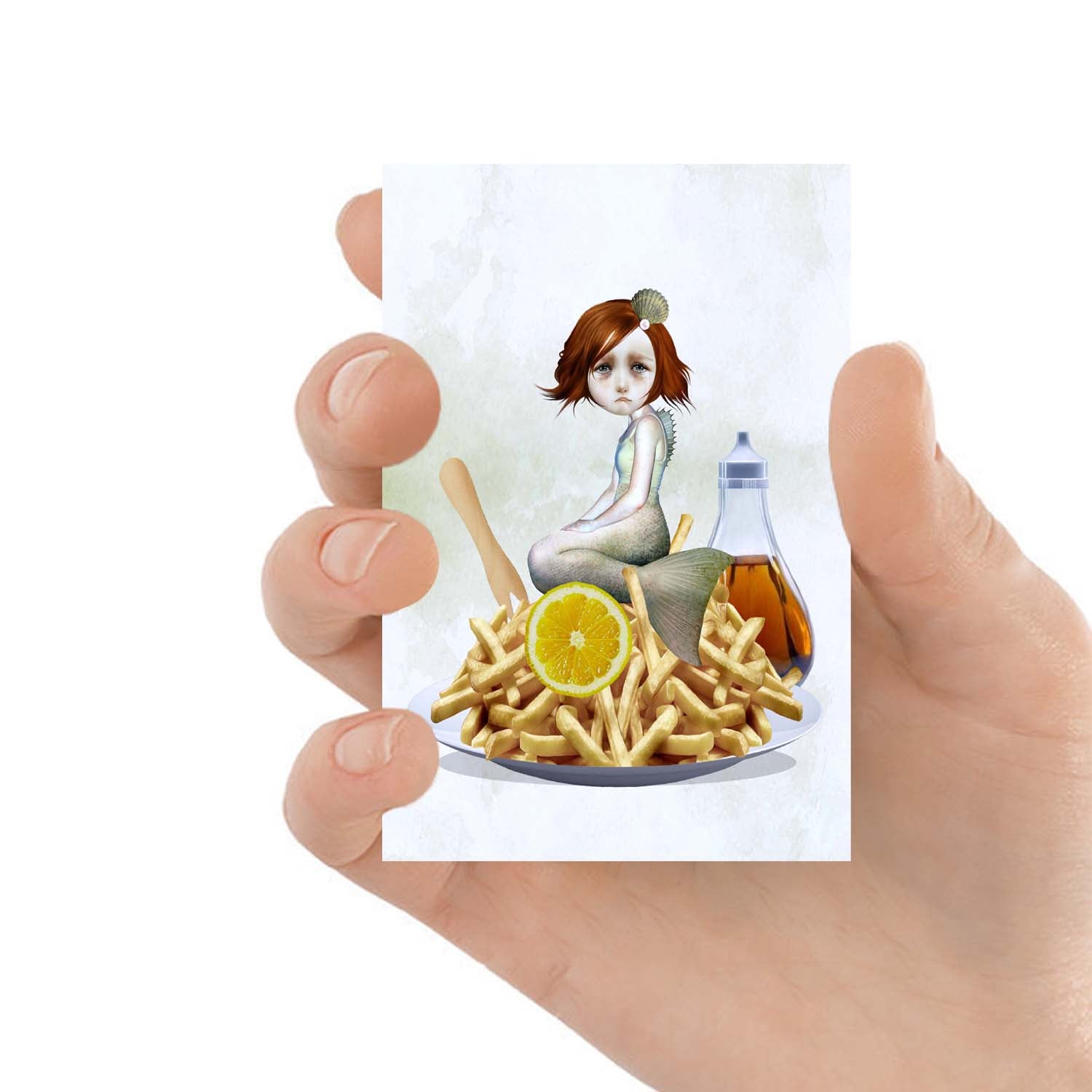 ACEO art card featuring a Mermaid with chips, held in hand to showcase the miniature size and quirky design.