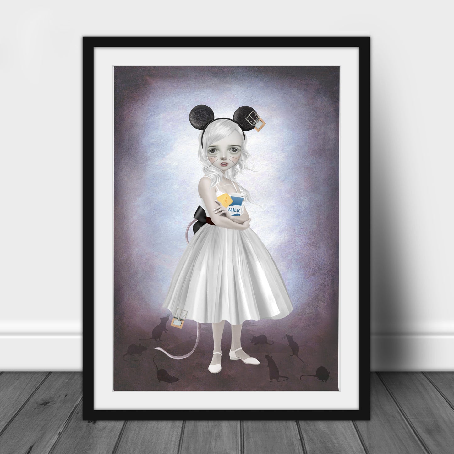 Art print of a mouse girl and mice, in a frame, leaned against a wall.