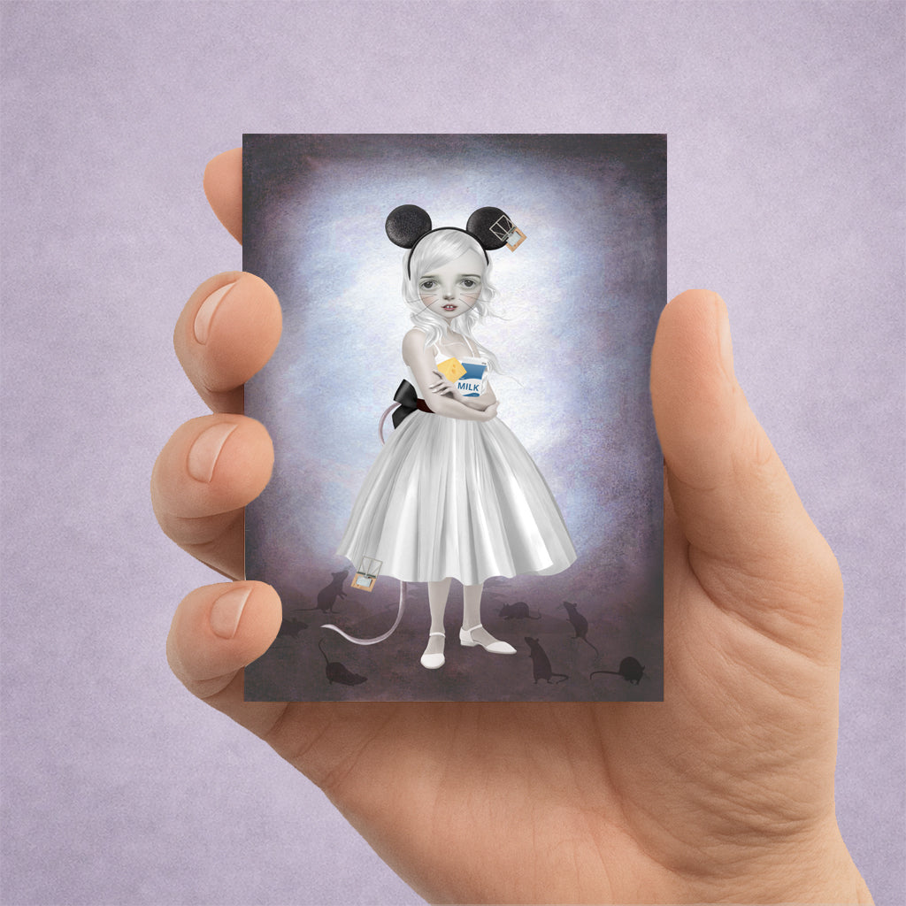 Surreal ACEO art card held in hand featuring a wide-eyed girl in mouse ears, surrounded by intricate symbolic details of comfort and hidden danger.