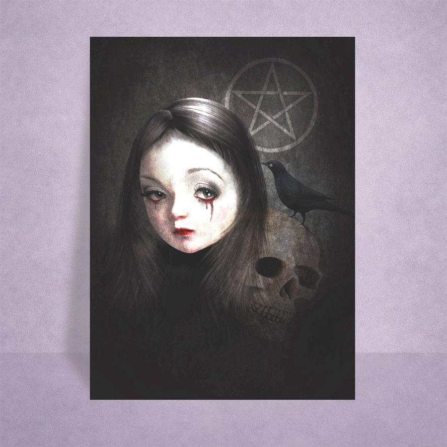 A gothic ACEO Art Card featuring a pale-skinned girl with dark hair, a blackbird, a skull, and a pentagram symbol on a dark textured background, displayed against a light purple wall.