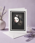 The Occultist dark gothic greeting card with white envelope, featuring a skull, blackbird, weeping girl, and pentacle.