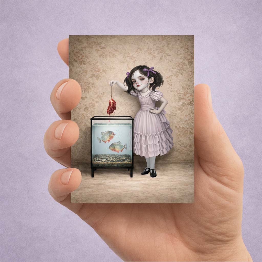 Piranha Girl ACEO Card held in a hand to show miniature scale.