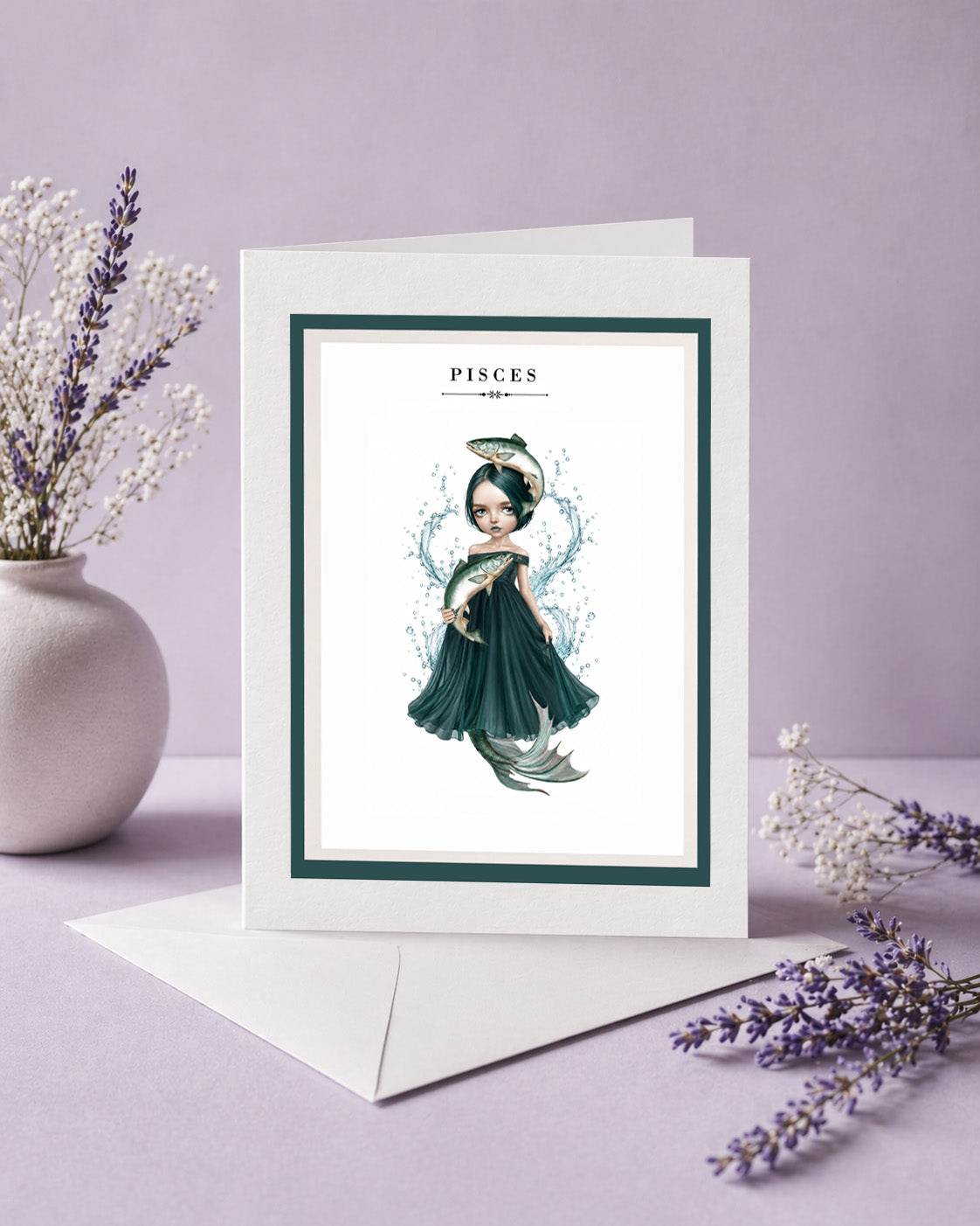 Pisces zodiac birthday card featuring an illustration of a dark-haired maiden in a deep teal dress with two fish and a mermaid tail, surrounded by splashing water.