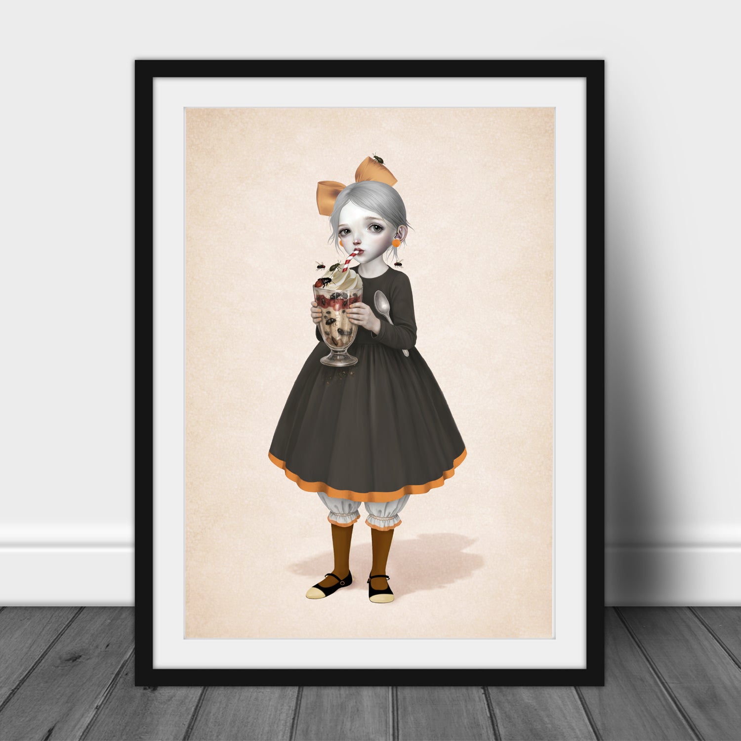 Framed artwork featuring a girl with a beetle sundae.