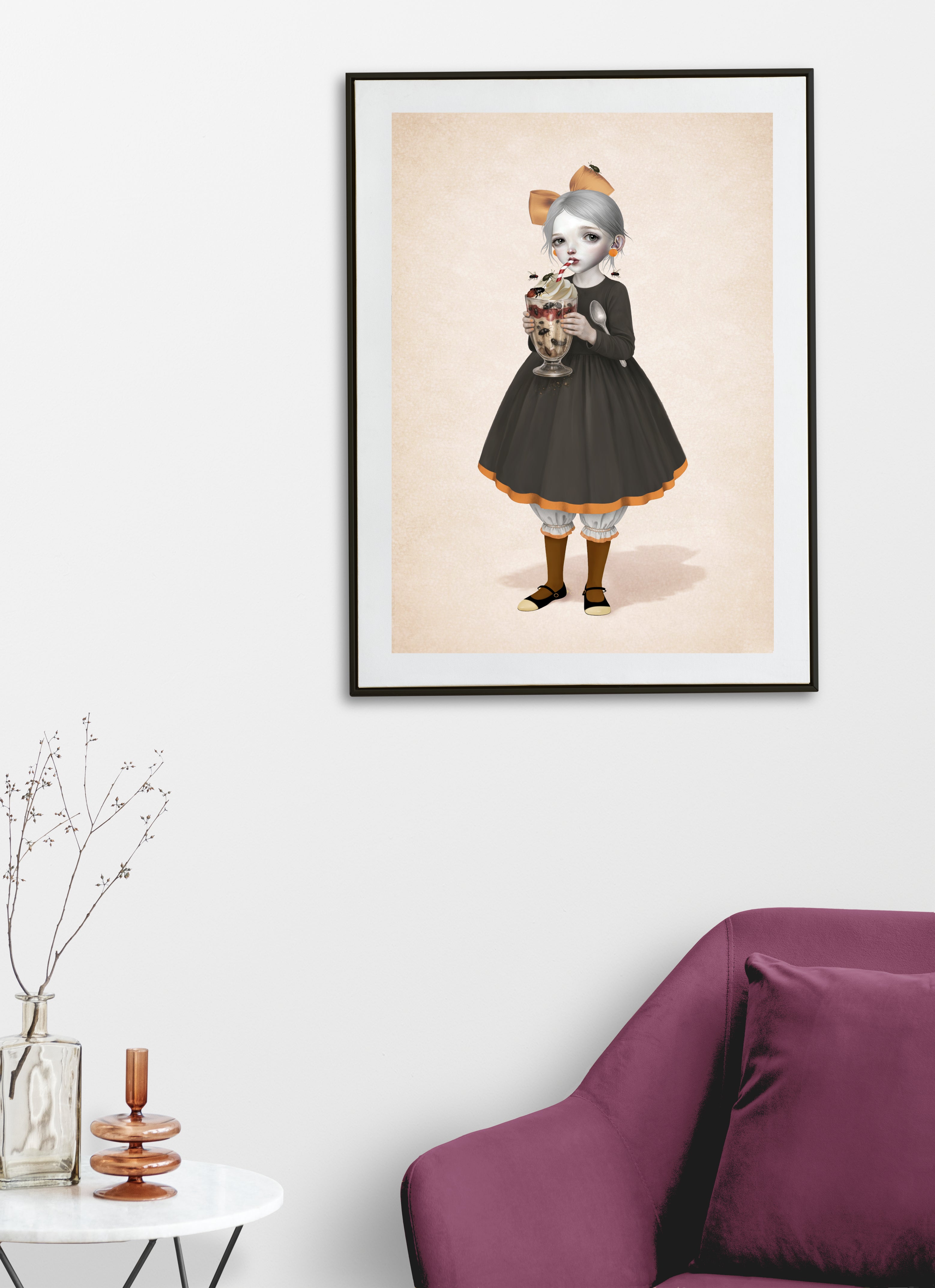 Framed artwork of a girl enjoying a srtrange dessert, a beetle sundae.
