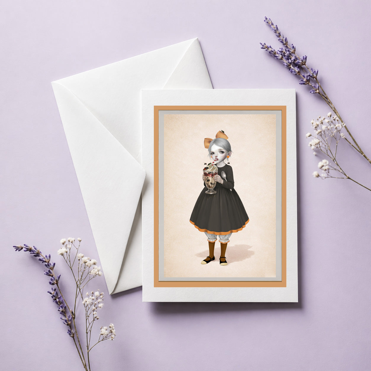Greeting card with illustration of a girl holding a large sundae covered in creepy crawlies, accompanied by a white envelope on a purple background.