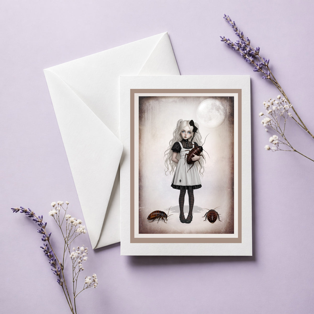 A standing greeting card with envelope, featuring dark surrealism art of a gothic girl holding a giant cockroach.
