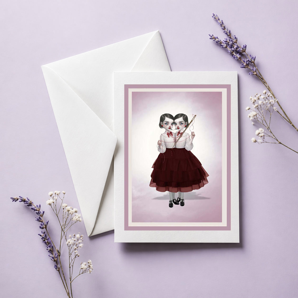 creepy cute greeting card featuring a dark surrealism illustration of conjoined twins sewing.