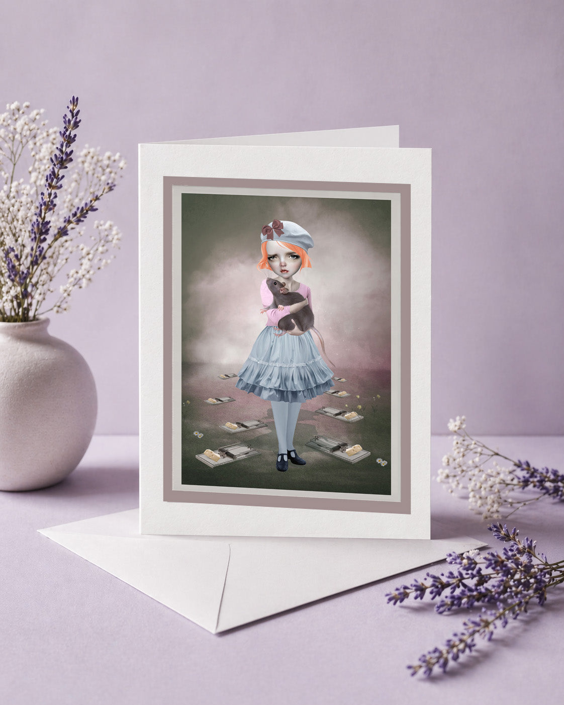 Greeting card with a stylized illustration of a girl holding an oversized rat, displayed on a lilac background.