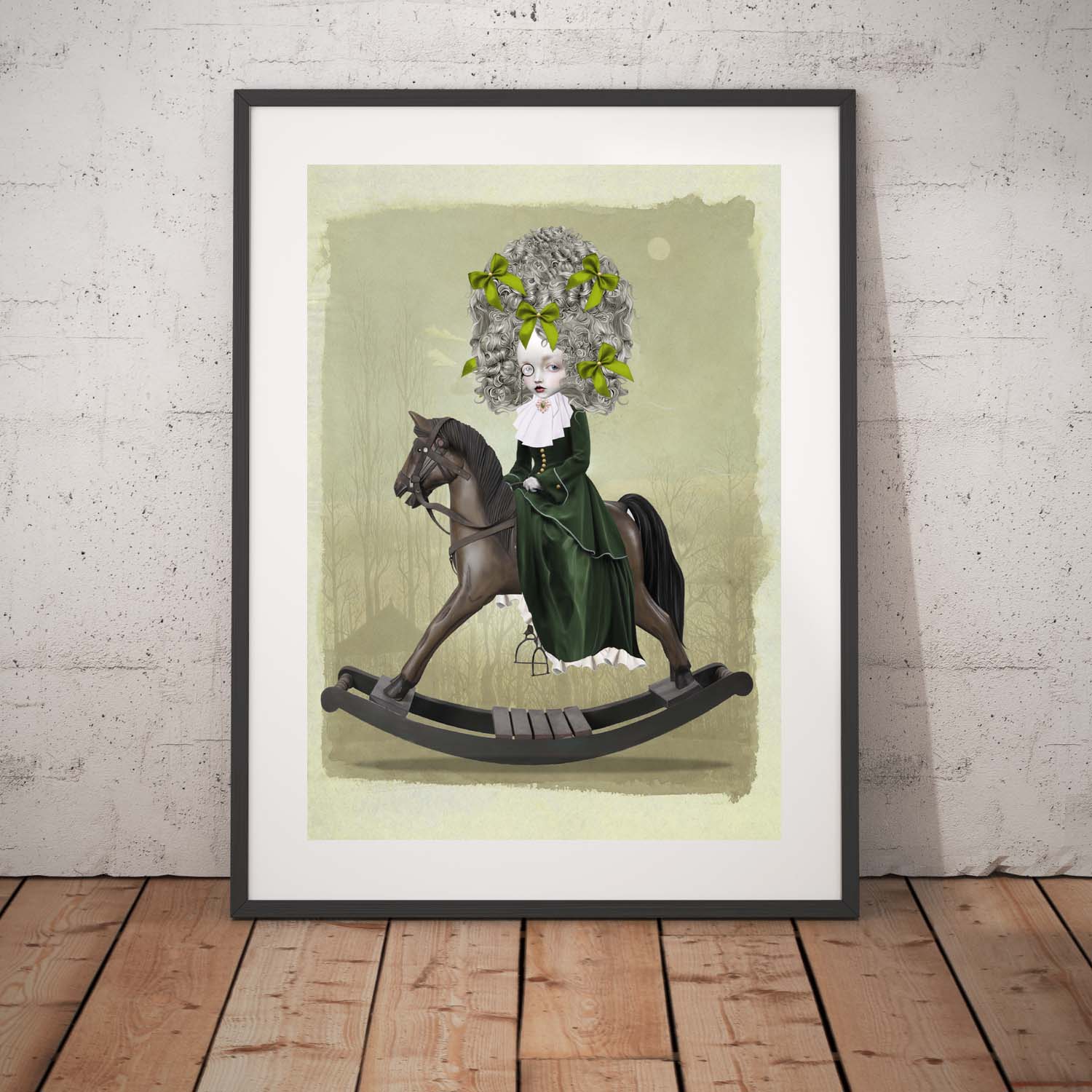 Rococo girl and rocking horse art print in a black frame, standing against a white wall.