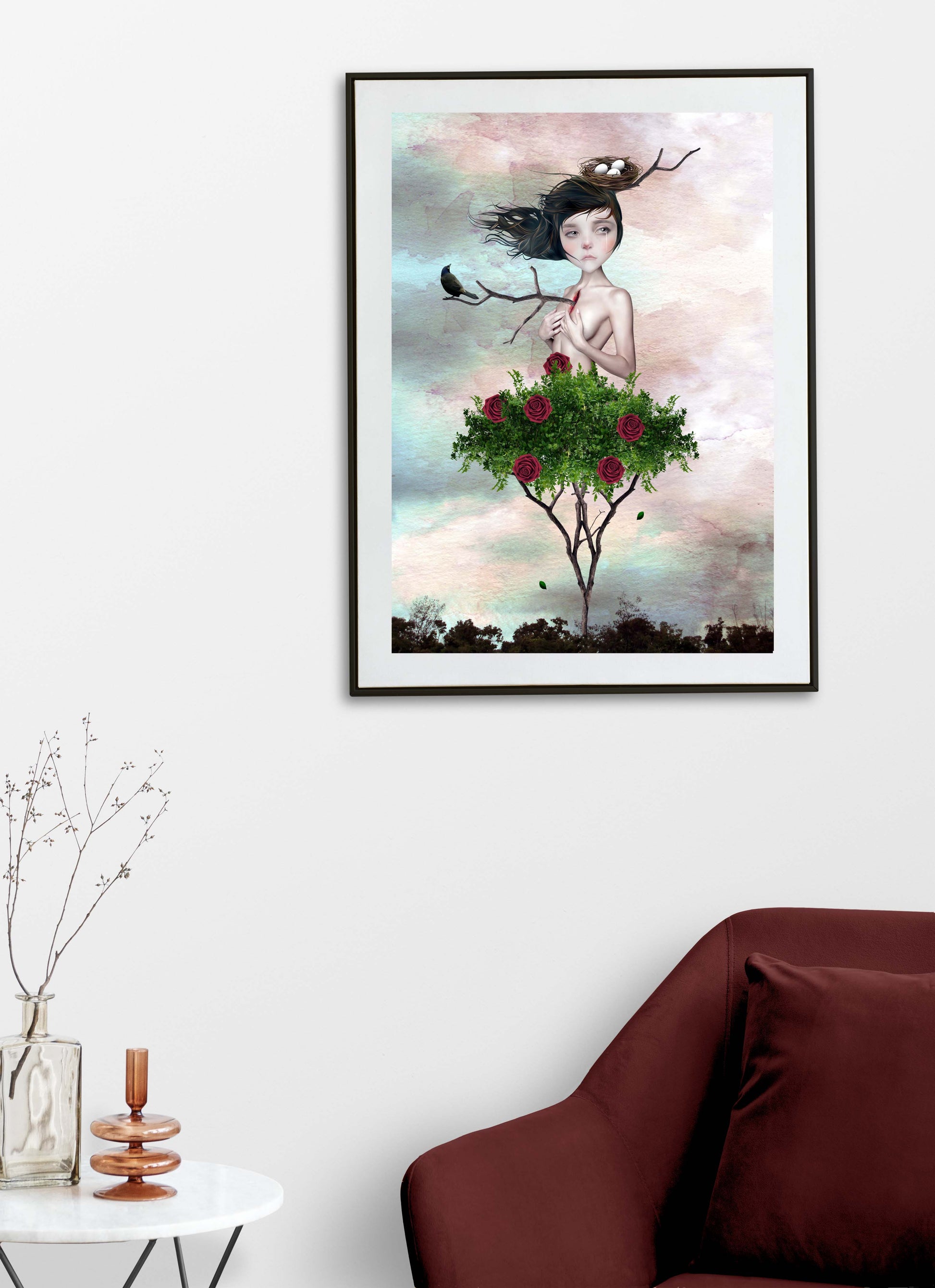 Framed Rose Bush Girl Art Print hanging on a living room wall.